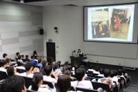 A founding student sharing her college life with the audience